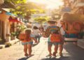 Family walking together through a sunny travel destination with backpacks and relaxed smiles
