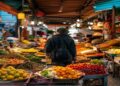 Traveller exploring a colorful local food market with fresh dishes and spices